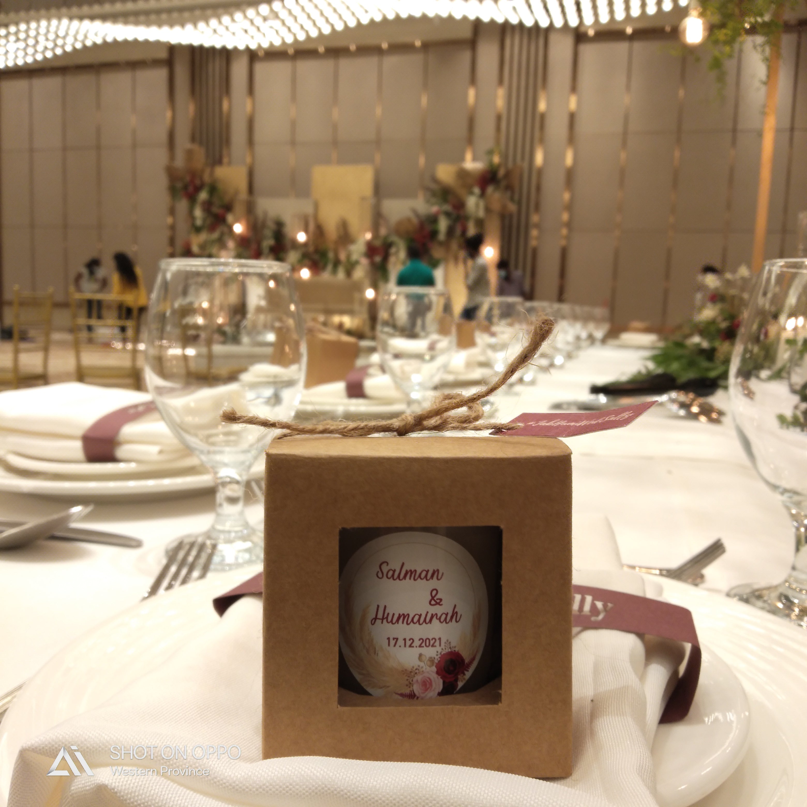 Personalised Candle House Ceylon wedding favour candle on a reception table